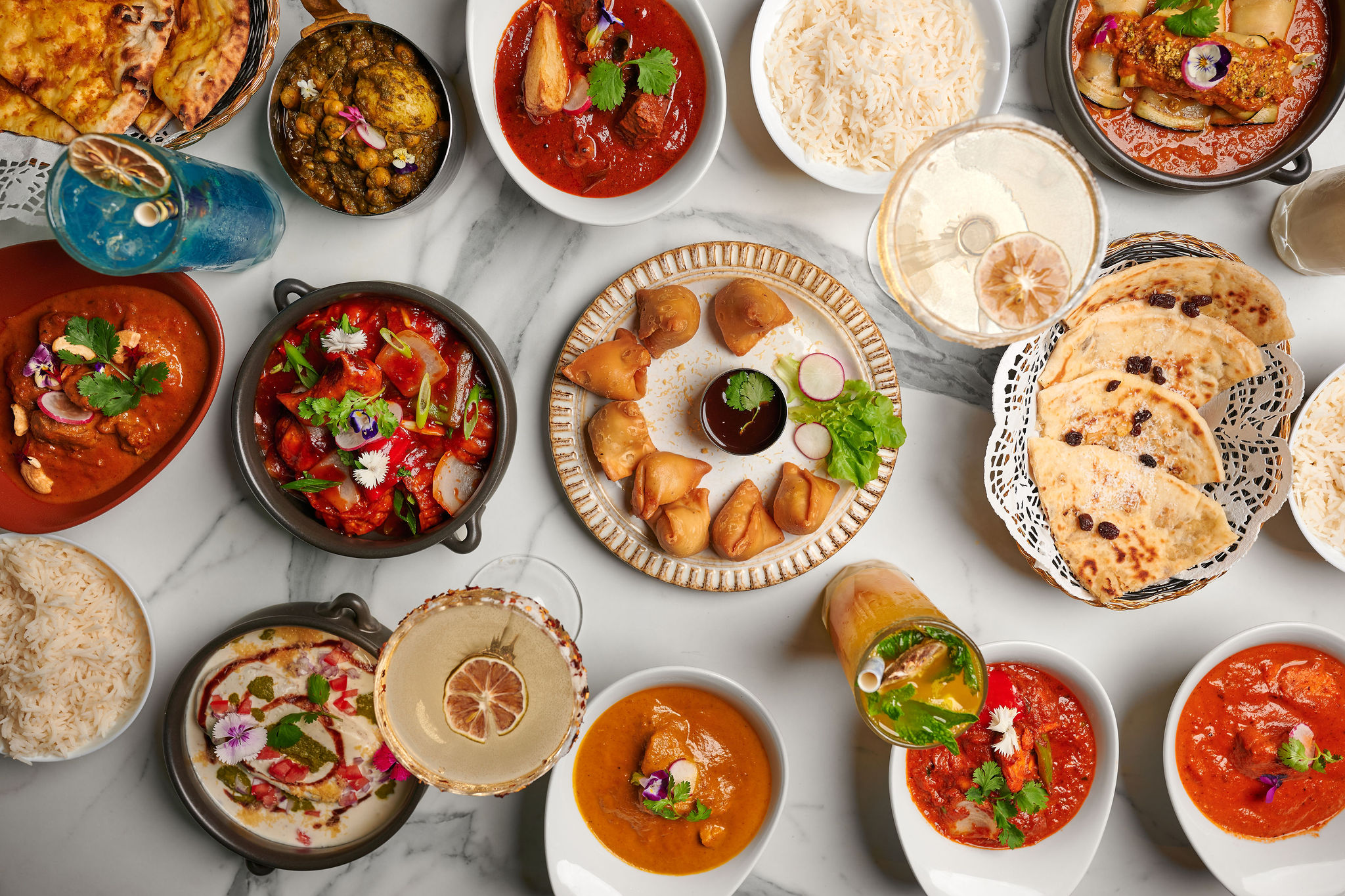 A colourful Kari feast with curries, naan and chutneys